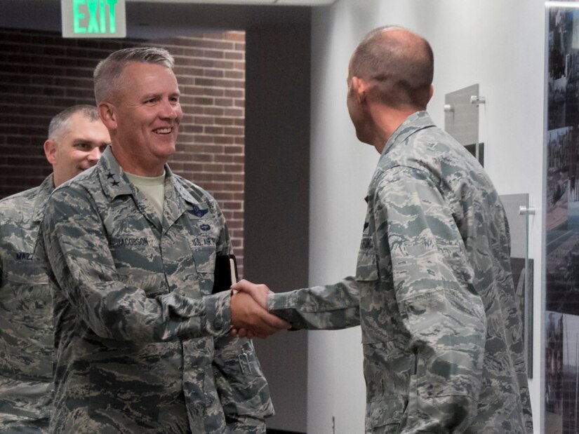 Maj. Gen. Jacobson & Col Teichert shake hands