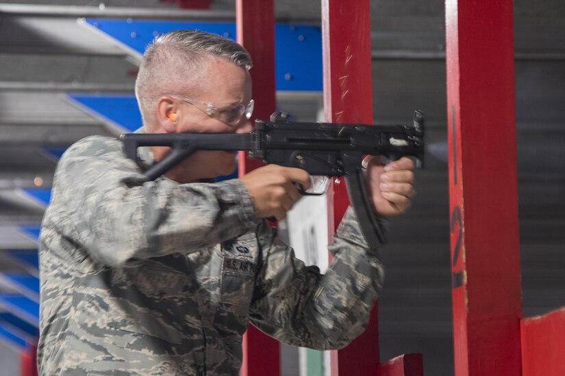 Maj. Gen. Jacobson shoots a weapon