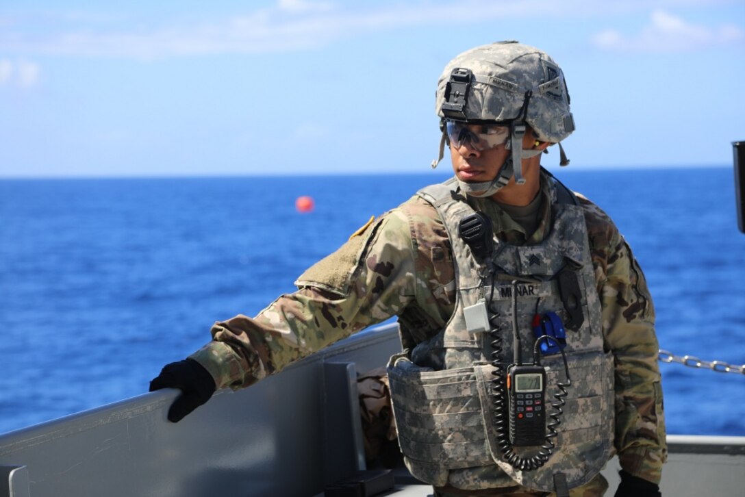 Army Sgt. James Munar, a Pomona, Calif., native and a culinary specialist with the 605th Transportation Detachment, 8th Special Troops Battalion, 8th Theater Sustainment Command, helps prepare for the waterborne gunnery mission on the logistic support vessel, the USAV CW3 Harold A. Clinger, off the Hawaiian coast, Oct. 4, 2017. Army photo by Staff Sgt. Melissa Parrish