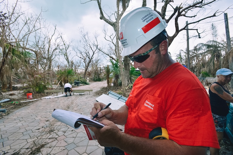Albert Masticola, a USACE blue roof quality assessor from the Louisville District, takes notes as he surveys damage done by Hurricane Irma to a home in Summerland Key, Florida.