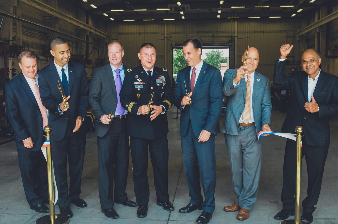 Major Gen. Troy D. Kok, commanding general of the 99th RSC, center, cut the ribbon at the revitalized facility in Fort Totten.