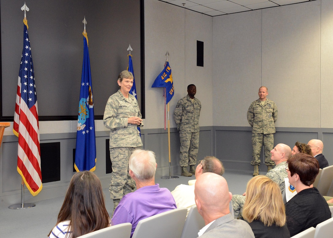 Gen. Ellen Pawlikowski, commander of Air Force Materiel Command, speaks to an audience at the U.S. Air Force Test Pilot School’s Dick Scobee Auditorium Oct. 12. Pawlikowski presided over a ceremony where TPS was recognized for winning the Air Force Organizational Excellence Award. (U.S. Air Force photo by Kenji Thuloweit)