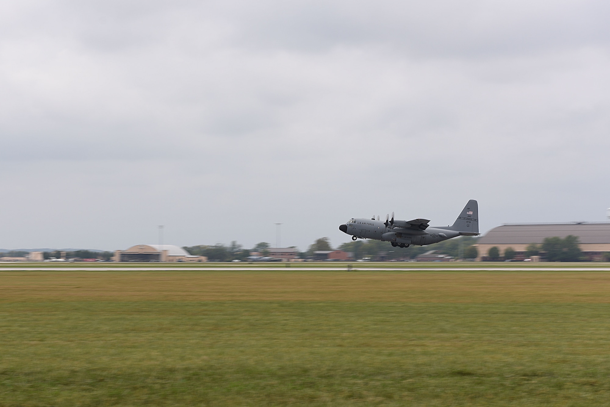 A C-130 lifts off the runway during take off at Scott Air Force Base, Illinois