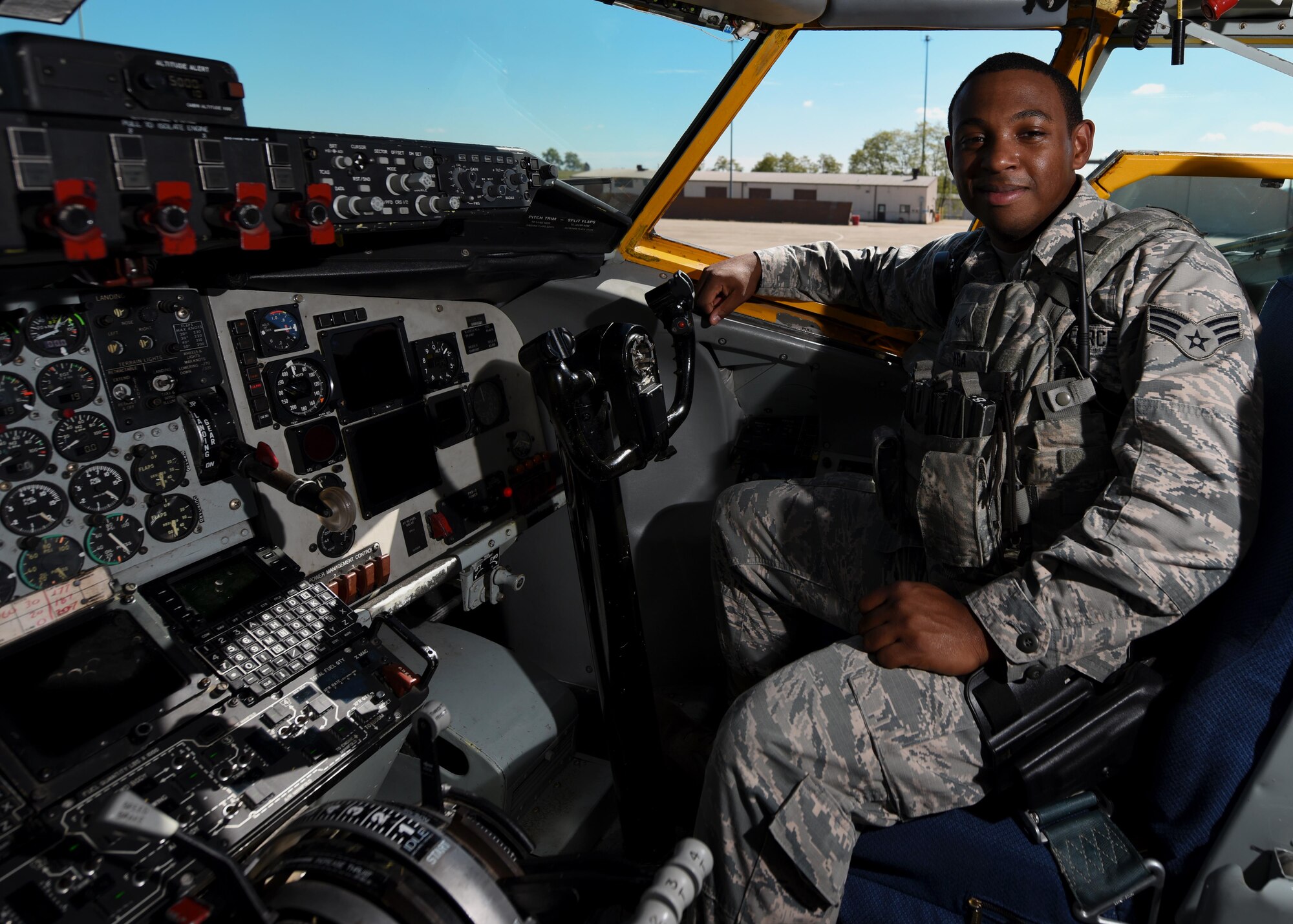 Senior Airman Demetrio V. Vega, stationed at the 171st Air Refueling Wing located near Pittsburgh Pennsylvania poses in cockpit of a KC-135 Tanker