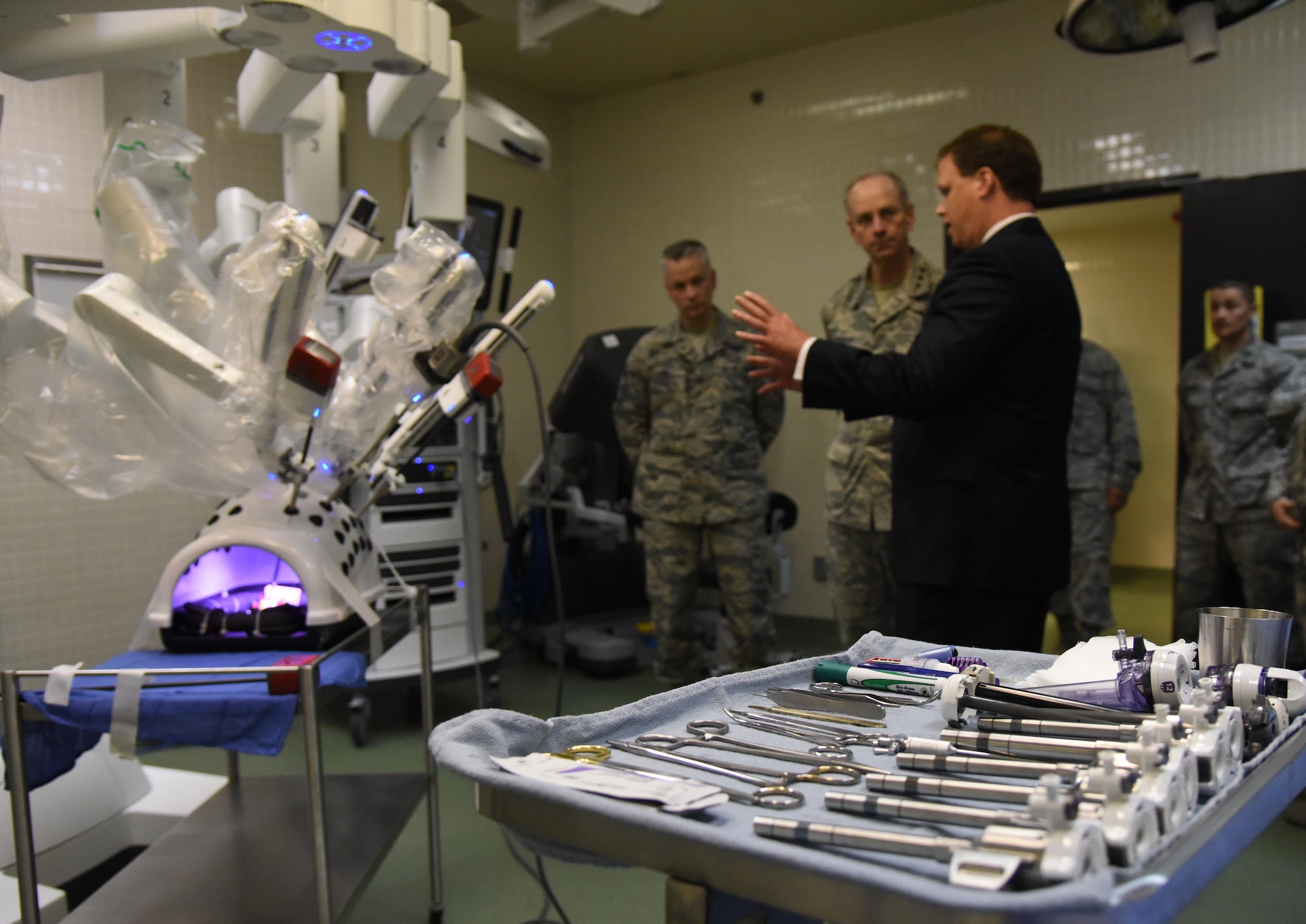Blaise Provitola, Intuitive Surgical Inc. area sales manager, briefs on the capabilities of robotics surgery to Lt. Gen. Mark Ediger, Air Force Surgeon General, and Chief Master Sgt. Steve Cum, Jr., Air Force Surgeon General medical enlisted force chief, during a visit to the clinical research laboratory  Oct. 17, 2017, on Keesler Air Force Base, Mississippi. The purpose of Ediger’s visit was to get familiar with the 81st Medical Group’s mission, operations and personnel. During his tour, he visited more than 10 different units in the 81st MDG to include mammography, emergency department, radiology and oncology, genetics and the clinical research laboratory. (U.S. Air Force photo by Kemberly Groue)