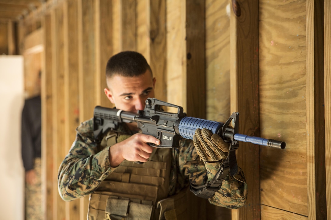 Pfc. Victor Valco, student, Basic Security Guard Course 16-17, prepares to enter a room during room-clearing drills conducted at Munro Village Training Area aboard Naval Support Activity Northwest Annex in Chesapeake, Va., Oct. 17. Students conducted multiple runs through three unique structures to rehears proper clearing procedures they were taught during the course. (Official Marine Corps photo by Chris Jones/Released)