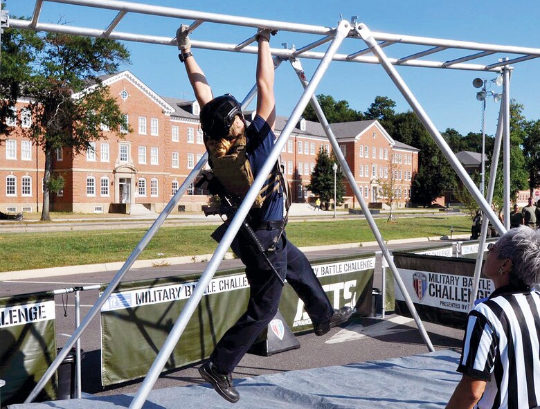 A Quantico Fire and Emergency Services member takes to the monkey bars.