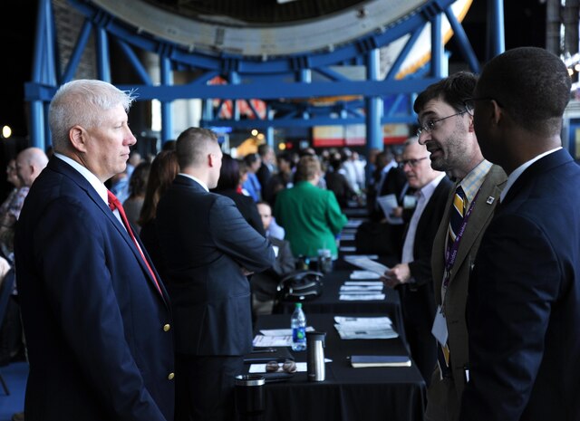 Bryan Rogers, Huntsville Center Army Central Metering Program chief, left, speaks with industry representatives during the Small Business Forum at the Davidson Center for Space Exploration in Huntsville, Alabama, Oct. 18. The forum helps to identify government needs and business capabilities in order to meet the nation’s engineering challenges.