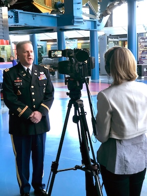 Lt. Col. Hugh Darville, Huntsville Center deputy commander, answers questions from WAFF reporter Stephanie Mills during the Small Business Forum at the Davidson Center for Space Exploration in Huntsville, Alabama, Oct. 18. The forum helps to identify government needs and business capabilities in order to meet the nation’s engineering challenges.