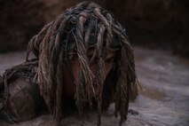 U.S. Marine Corps Pfc. Mitchell Jensen, a rifleman with 1st Light Armored Reconnaissance Battalion (LAR), 1st Marine Division, emerges from a mud puddle during an exercise at Marine Corps Base Camp Pendleton, Calif., Oct. 13, 2017.