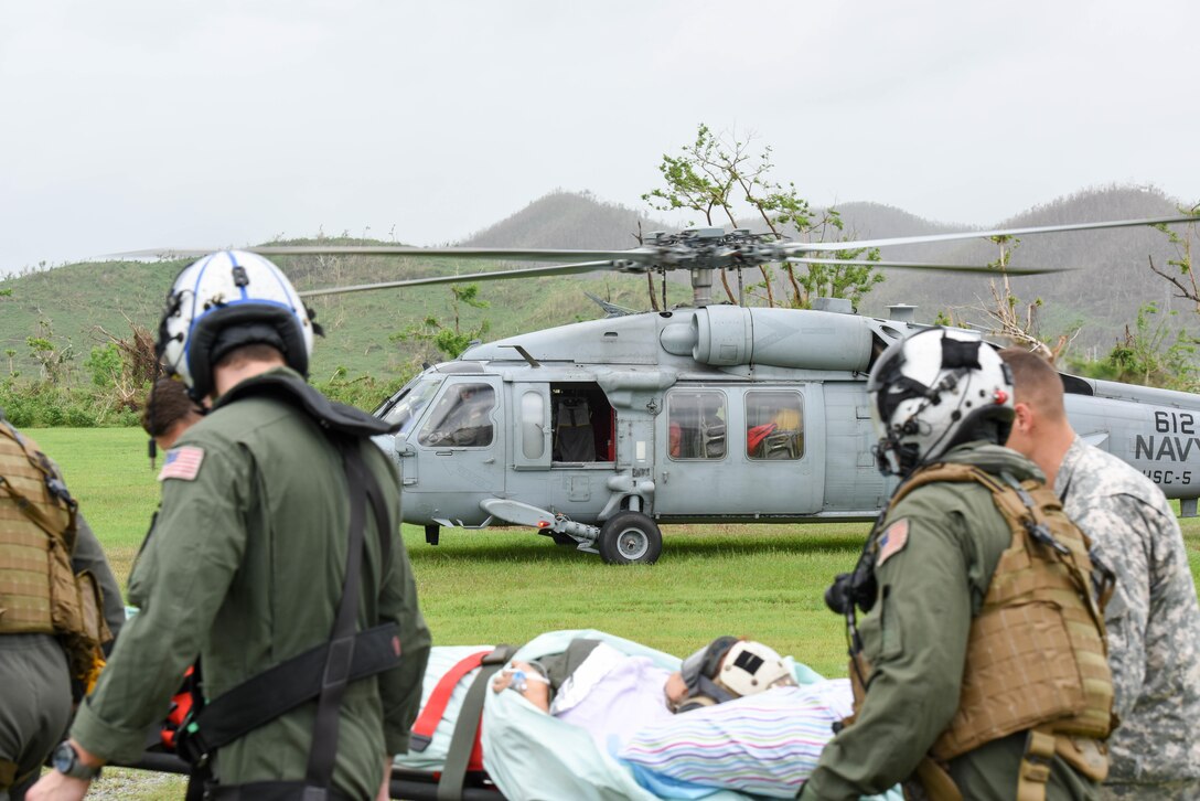 A patient is transferred to the USNS Comfort.