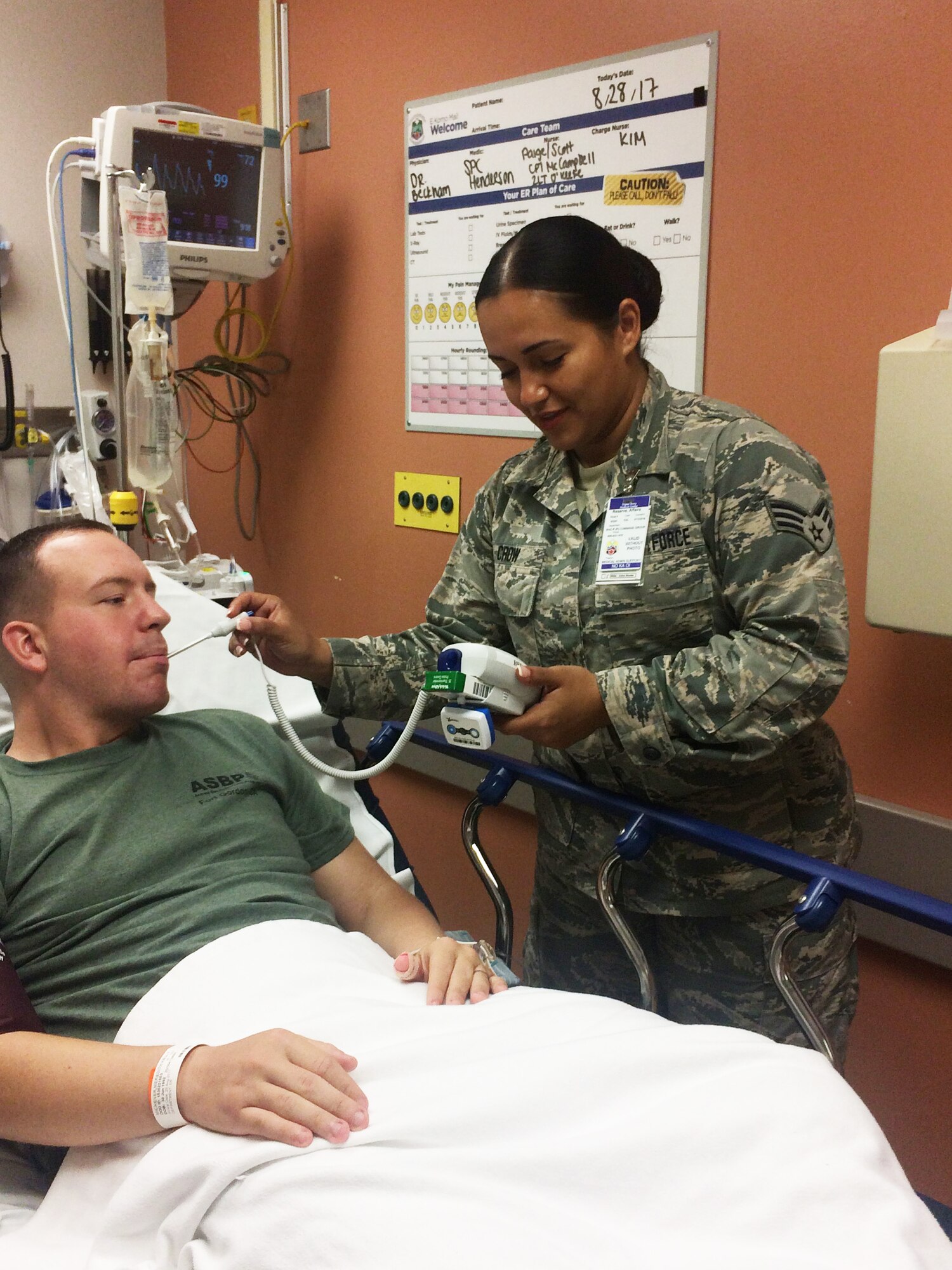 U.S. Air Force Senior Airman Wendy Crow, a medical technician in the New York Air National Guard's 106th Rescue Wing, takes the temperature of a patient at Joint Base Pearl Harbor-Hickam in Hawaii Aug. 29, 2017. 106th Rescue Wing Medical Group members went on a 13-day deployment for training opportunity, which wrapped up in September, came about for 106th Rescue Wing medical personnel after scoring in the top five of 90 medical units evaluated in the nation.