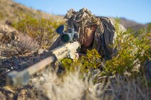 U.S. Marine Corps Lance Cpl. Joseph Starr, a professionally instructed gunman with Regimental Surveillance and Target Acquisition Company (RSTAC), 1st Marine Division, acquires targets during a field operation at Fort Irwin, Calif., October 2, 2017.
