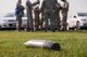 An unexploded ordinance (UXO) lies in the grass during a PAR exercise Oct. 14.  934th Airlift Wing personnel participated in the exercise as part of an initiative to re-emphasize ATSO skills. (U.S. Air Force photo by Tech. Sgt. Trevor Saylor)