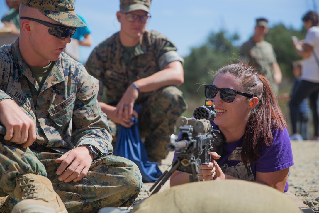 Vanessa Burback, a U.S. Marine spouse, shoots a M27 infantry automatic rifle during Jane Wayne day at Marine Corps Base Camp Pendleton, Calif., Sept. 29, 2017.
