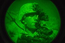 A U.S. Marine with Regimental Surveillance & Target Acquisition Company (RSTAC), 1st Marine Division, looks through a PVS-14 night vision scope during a night insert at Fort Irwin, Calif., Oct. 1, 2017.