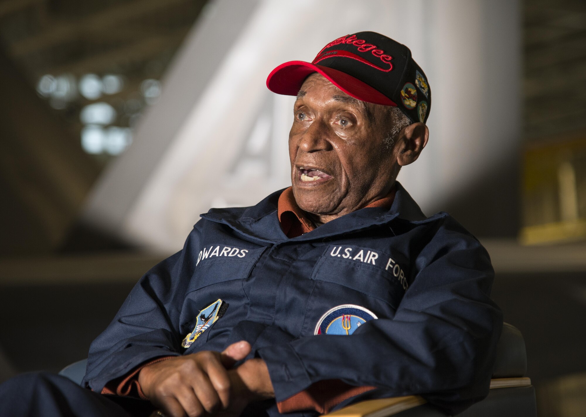 Army Air Corps Staff Sgt. Leslie Edwards, the last living Tuskegee Airman  of the 477th Bombardment Group, speaks with historians at Joint Base Elmendorf-Richardson, Alaska, Oct. 14, 2017. In 2007, the 477th Bombardment Group became the 477th Fighter Group, bringing with it the legacy of Tuskegee Airmen to Alaska. (U.S. Air Force photo by Senior Airman Curt Beach)