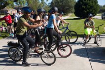 Marines and Sailors socialize prior to a unit bike ride hosted by 2nd Marine Logistics Group at Camp Lejeune, N.C. Oct. 18, 2017. The bike ride afforded participants the opportunity to come together and strengthen unit cohesion and camaraderie. The Participants are with 2nd Marine Logistics Group. (U.S. Marine Corps photo by Pfc. Nicholas Guevara)
