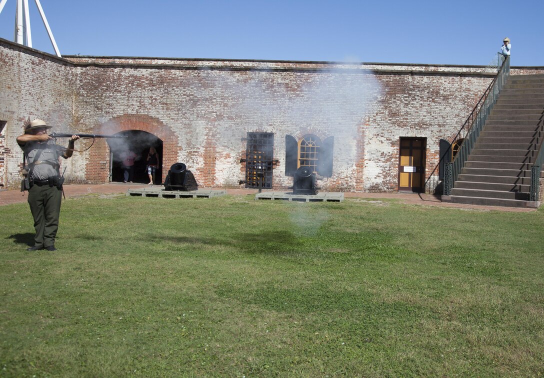 Randy Newman, park superintendent, demonstrates proper musket-firing procedures to Marines from U.S. Marine Corps Forces, Special Operations Command’s Lance Corporal Leadership and Ethics Seminar during a tour at Fort Macon State Park, N.C., Oct. 18, 2017.  The Marines learned Civil War history, tactics and small unit leadership that they will later evaluate in their advanced military education seminars. The focus of the Lance Corporal Seminar is to enhance small unit leadership, educate junior leaders on Marine Corps doctrine and principles and sustain the transformation of all Marines that begins in bootcamp. The course covers Marine Corps values and ethics, foundations of leadership, personal conduct and a holistic approach to fitness. (U.S. Marine Corps photo by Cpl. Bryann K. Whitley, released)
