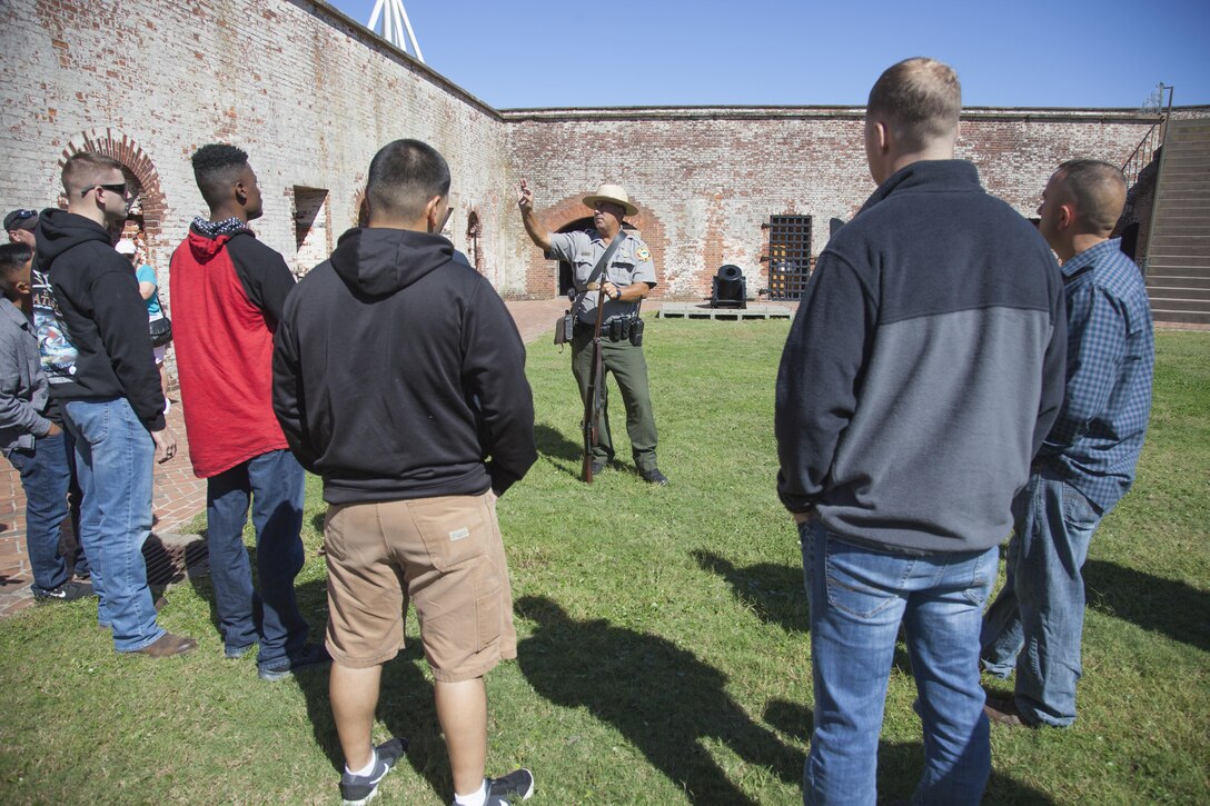 Randy Newman, Fort Macon State Park superintendent, educates Marines from U.S. Marine Corps Forces, Special Operations Command’s Lance Corporal Leadership and Ethics Seminar on musket nomenclature and firing procedures during a battlefield tour at Fort Macon State Park, N.C., Oct. 18, 2017.  The Marines learned about local history and warfare tactics that they will later evaluate in their advanced military education seminars. The focus of the Lance Corporal Seminar is to enhance small unit leadership, educate junior leaders on Marine Corps doctrine and principles and sustain the transformation of all Marines that begins in bootcamp. The course covers Marine Corps values and ethics, foundations of leadership, personal conduct and a holistic approach to fitness. (U.S. Marine Corps photo by Cpl. Bryann K. Whitley, released)