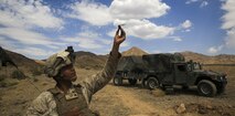 Cpl. Jerrick Espino, an intelligence analyst with 2nd Battalion, 7th Marine Regiment, 1st Marine Division, lands a PD-100 Black Hornet micro unmanned aerial vehicle during a Marine Corps Combat Readiness Evaluation at Marine Air Ground Combat Center Twentynine Palms, Calif., July 8, 2017.