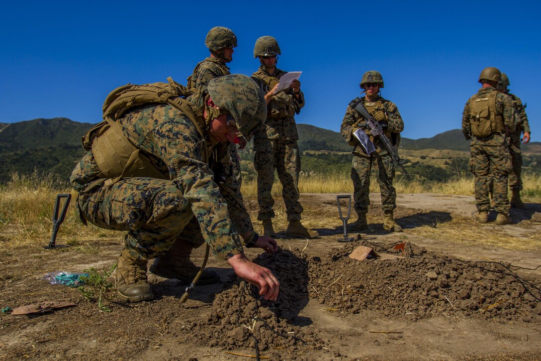 Marines with 4th Combat Engineer Battalion, 4th Marine Division, create a terrain model during the SAPPER Squad Competition held at Camp Pendleton, Calif., from June 12 to 16, 2017.