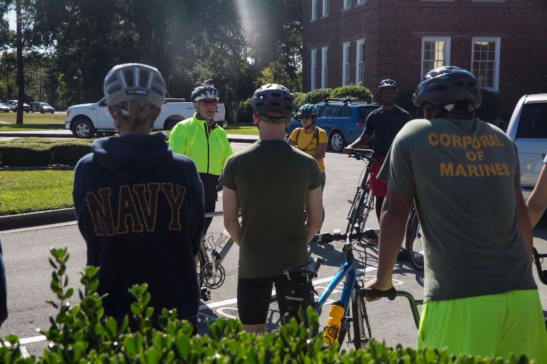 Brig. Gen. David W. Maxwell, the commanding general for 2nd Marine Logistics Group, speaks to Marines and Sailors prior to a unit bike ride at Camp Lejeune, N.C. Oct. 18, 2017. The bike ride afforded participants the opportunity to come together and strengthen unit cohesion and camaraderie. The Participants are with 2nd Marine Logistics Group. (U.S. Marine Corps photo by Pfc. Nicholas Guevara)