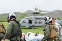 A patient is transferred to the USNS Comfort.