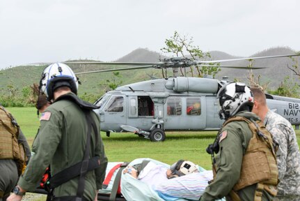 A patient is transferred to the USNS Comfort.
