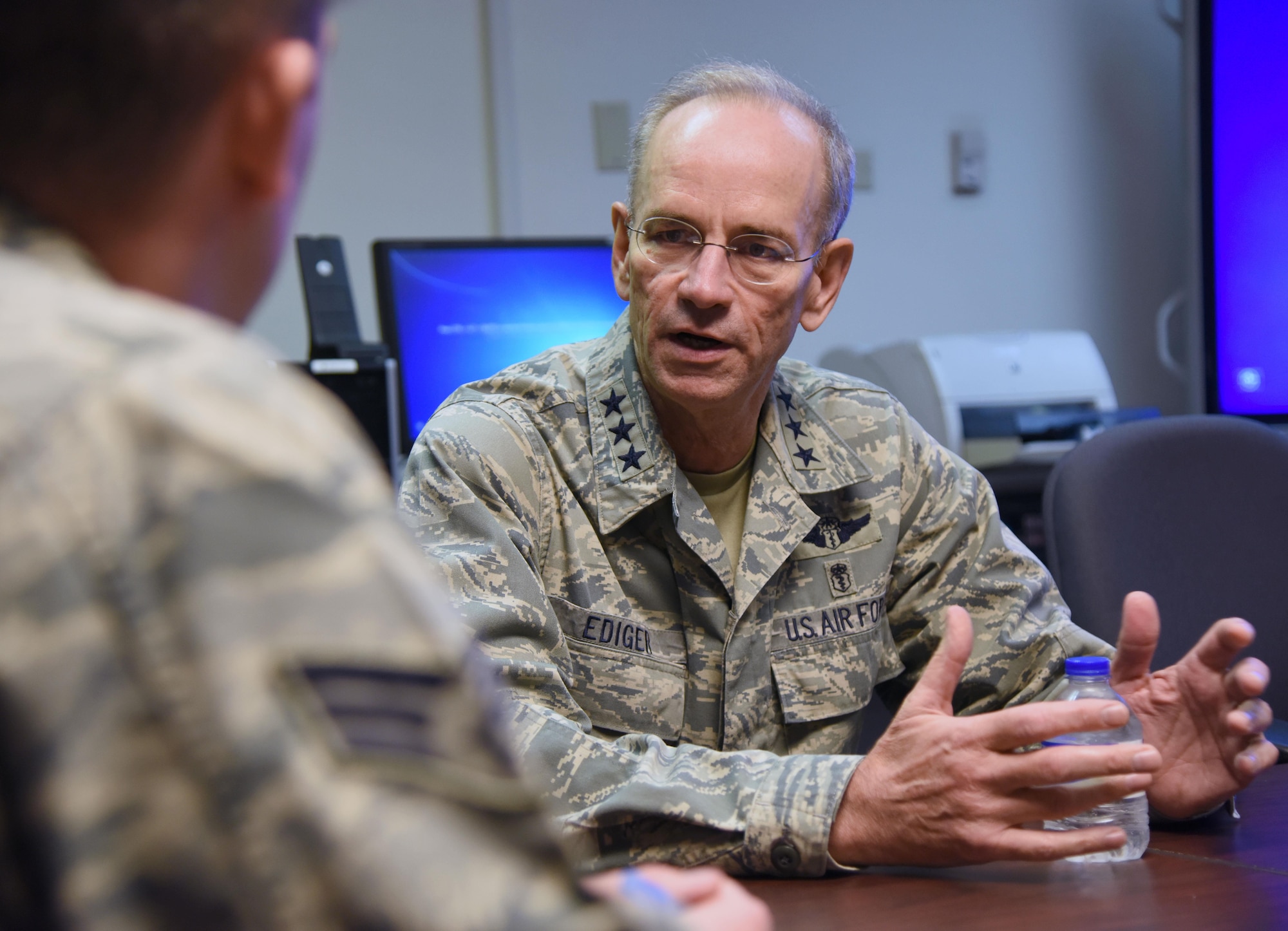 Lt. Gen. Mark Ediger, Air Force Surgeon General, speaks with Airmen during a visit to the Clinical Research Lab, Oct. 17, 2017, on Keesler Air Force Base, Mississippi. Ediger retires from the Air Force, June 1, 2018. (U.S. Air Force photo by Kemberly Groue)