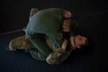 Airmen assigned to the 86th Airlift Wing practice ground combatives during a survival, evasion, resistance, escape training at Ramstein Air Base, Germany, Oct. 17, 2017. The training is designed to teach members basic skills to protect themselves.  (U.S. Air Force photo by Airman 1st Class Devin M. Rumbaugh)