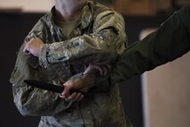 An Airman assigned to the 86th Airlift Wing practices a combative technique during a survival, evasion, resistance, escape training at Ramstein Air Base, Germany, Oct. 17, 2017.  The training teaches Airmen to defend themselves from enemies using weapons such as knives and handguns. (U.S. Air Force photo by Airman 1st Class Devin M. Rumbaugh)