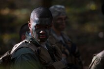 Staff Sgt. Yannick Sharras, 86th Aeromedical Evacuation Squadron aeromedical evacuation technician, looks back at his captors  during a survival, evasion, resistance, escape field training exercise at U.S. Army Garrison Rheinland-Pfalz, Oct. 18, 2017. The exercise included the members camouflaging themselves to avoid being detected by any hostile forces in the area. (U.S. Air Force photo by Airman 1st Class Devin M. Rumbaugh)