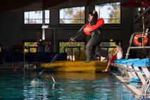 Senior Airman Patrick Cassidy, 37th Airlift Squadron loadmaster, is tugged into the water during a survival, evasion, resistance, escape training at Ramstein Air Base, Germany, Oct. 16, 2017.  The training is designed to simulate a member’s parachute being drug by a current after landing in water. (U.S. Air Force photo by Airman 1st Class Devin M. Rumbaugh)