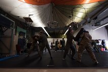 Airmen assigned to the 86th Airlift Wing practice combative techniques during a survival, evasion, resistance, escape training at Ramstein Air Base, Germany, Oct. 17, 2017. The training is designed to teach Airmen how to survive situations where they may be in austere conditions. (U.S. Air Force photo by Airman 1st Class Devin M. Rumbaugh)