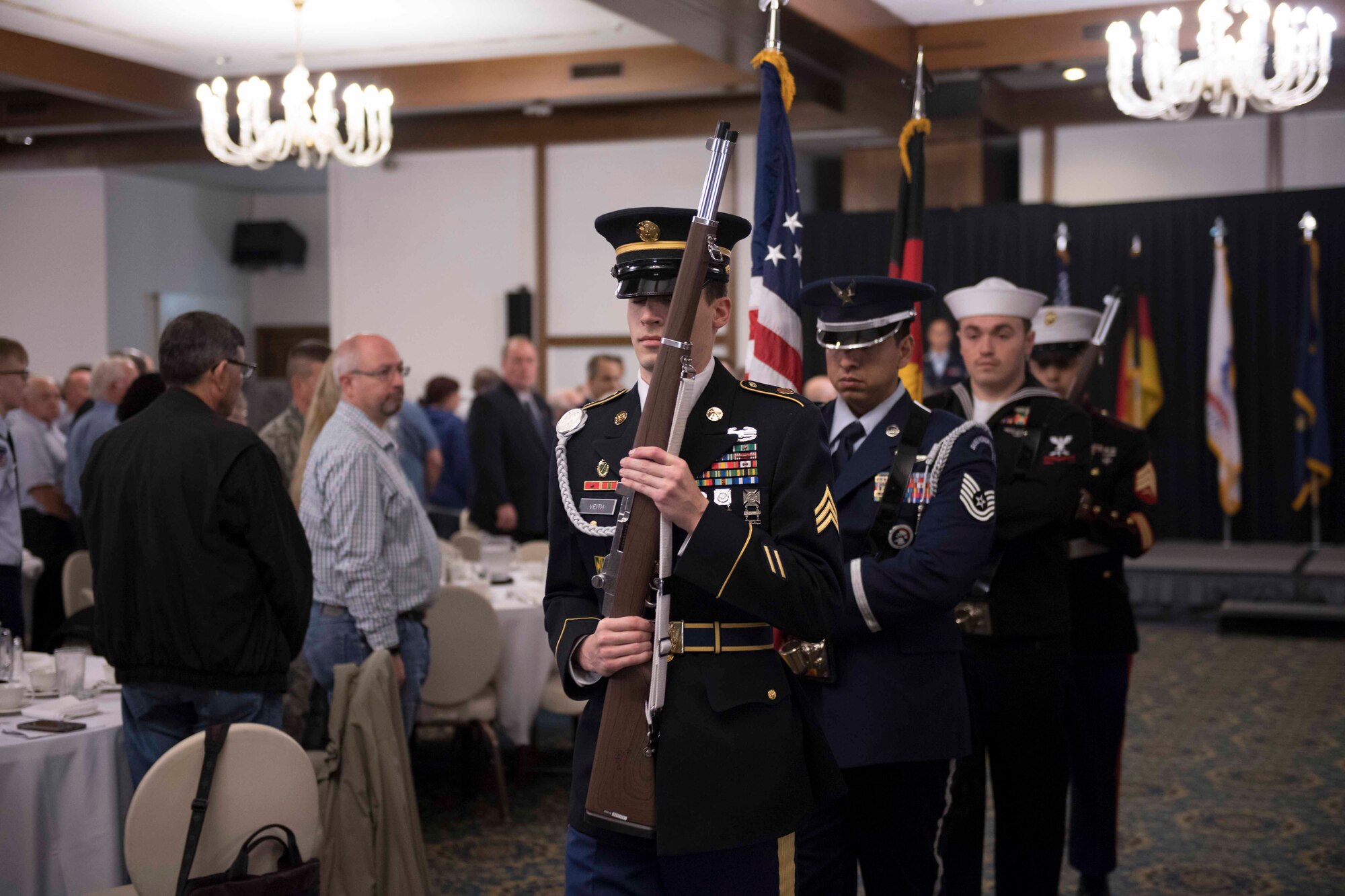 The Joint Color Guard conclude their ceremony for Retiree Appreciation Day at the Ramstein Officer’s Club on Oct. 18, 2017. The Joint Color Guard ceremony, and both national anthems performed by a United States Air Forces in Europe band performer, were well received by members of the audience.