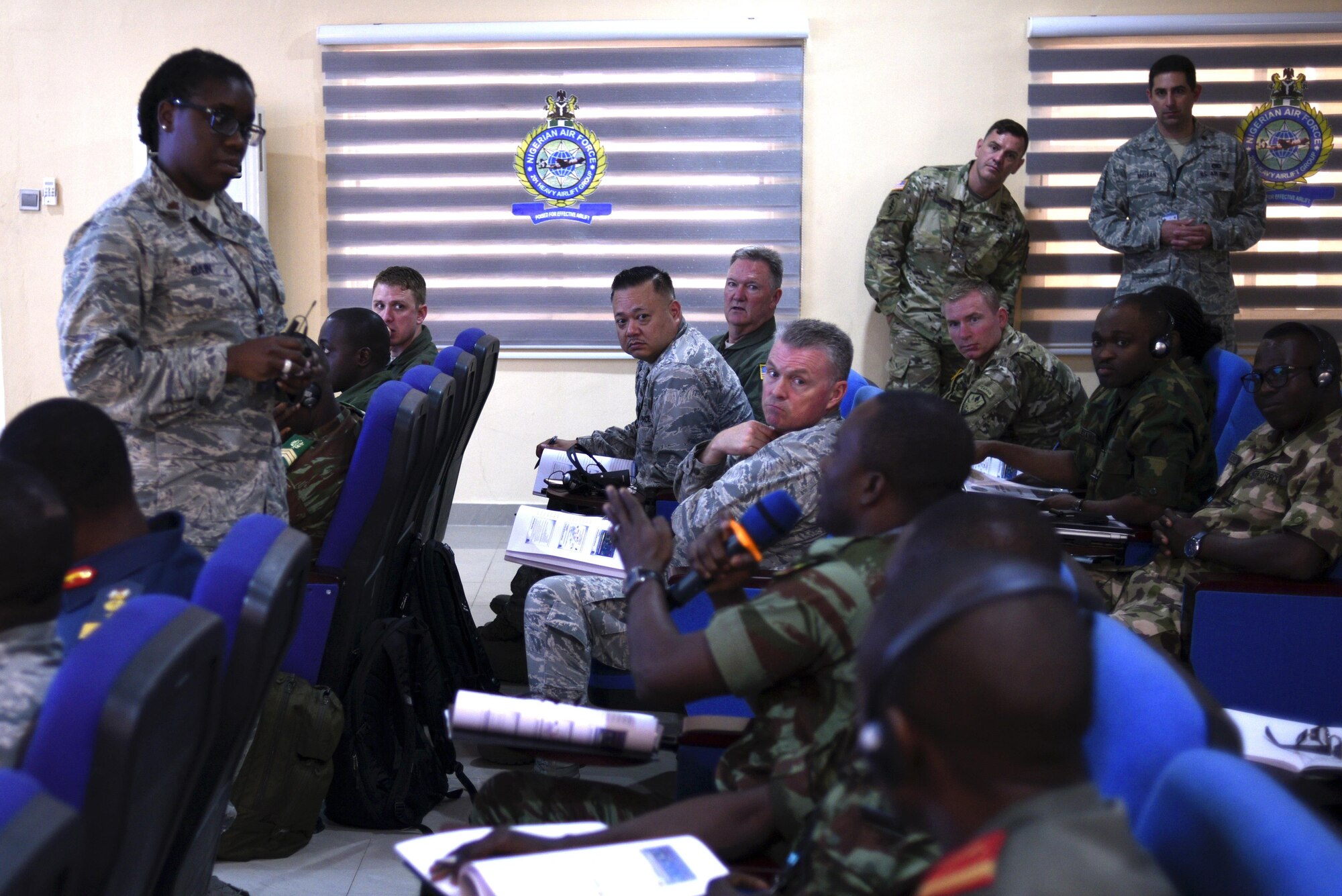 A participant asks Maj. Allison Bain, U.S. Air Forces Europe - Air Forces Africa Surgeon General medical plans and operations chief, about medical planning during her brief, Lagos, Nigeria, Aug. 15, 2017.