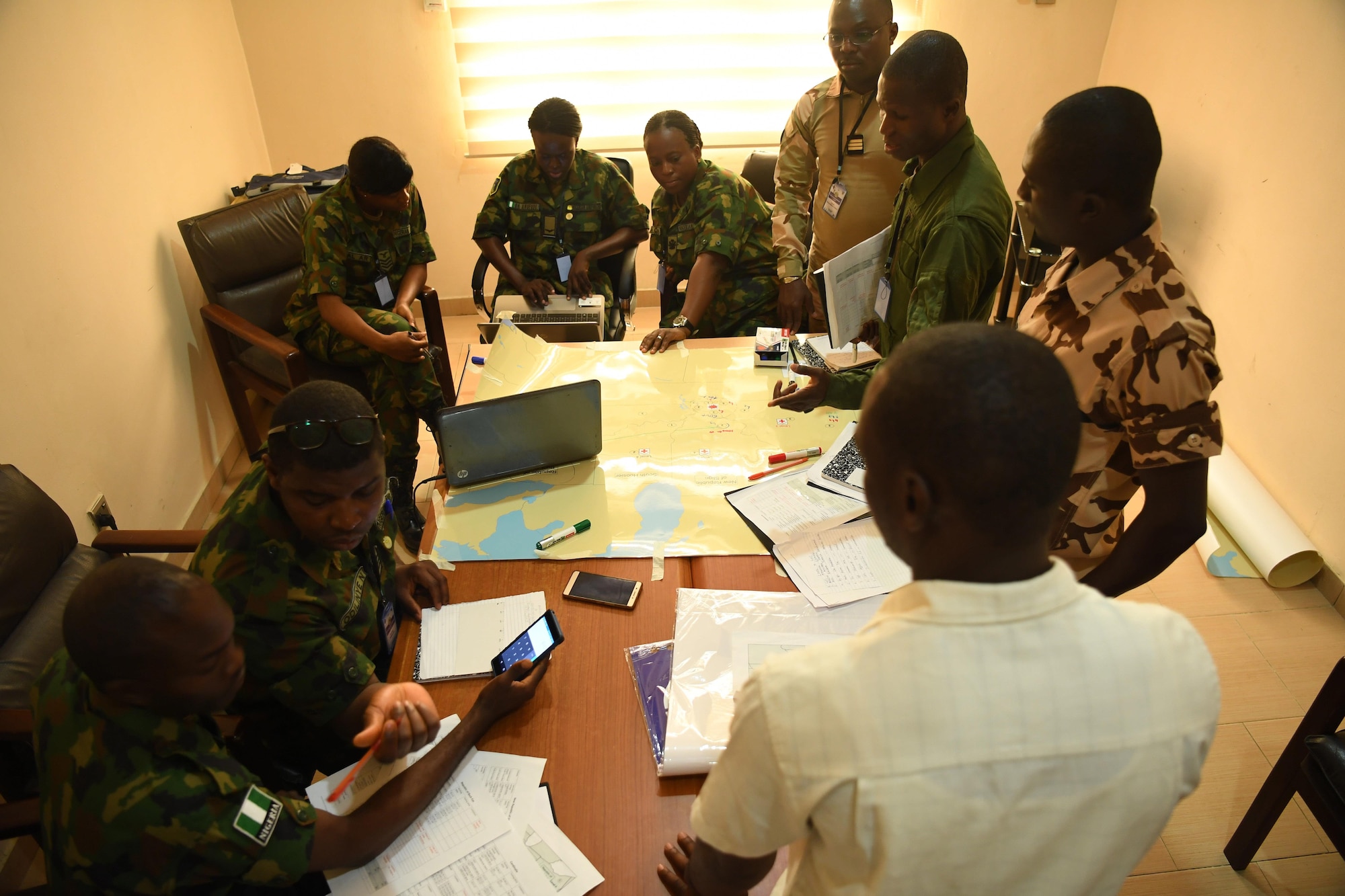 Airmen from Nigeria, Niger, Chad, and Benin discuss options for aeromedical support during African Partnership Flight Nigeria, Lagos, Nigeria, Aug. 17, 2017.