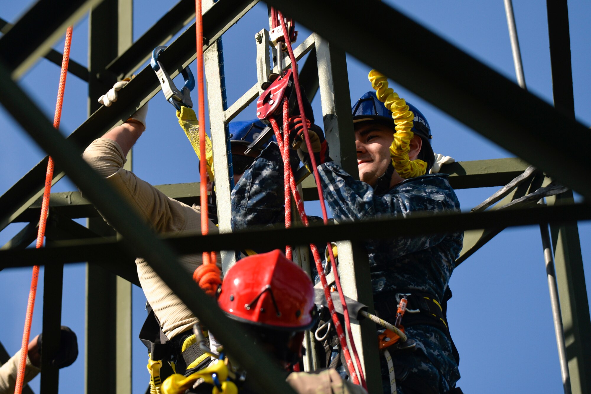 Soldiers, Seamen and Airmen simulate a rescue mission during a tower and rescue climbing training on Ramstein Air Base, Germany, Oct. 19, 2017. The course was hosted by the 1st Communication Maintenance Squadron Airmen. (U.S. Air Force photo by Staff Sgt. Nesha Humes Stanton)