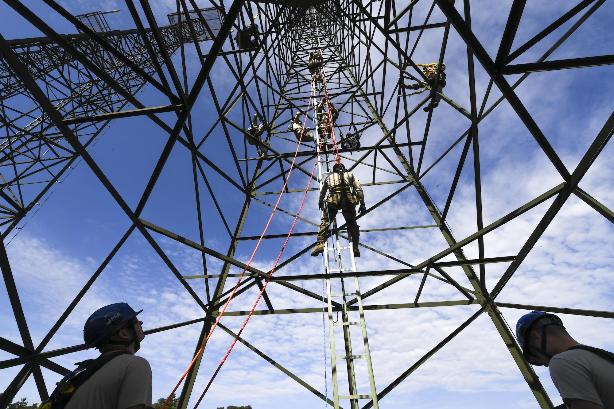 Soldiers, Seamen and Airmen simulate a rescue mission during a tower and rescue climbing training on Ramstein Air Base, Germany, Oct. 19, 2017. The course was hosted by the 1st Communication Maintenance Squadron Airmen. (U.S. Air Force photo by Staff Sgt. Nesha Humes Stanton)