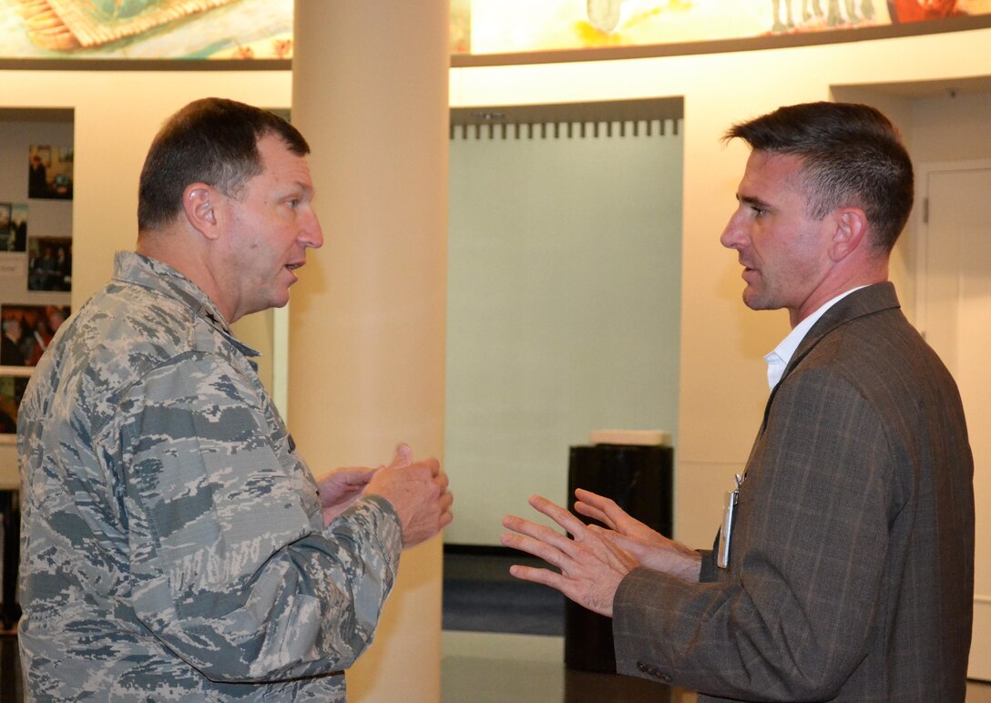 Profile view, two men conversing