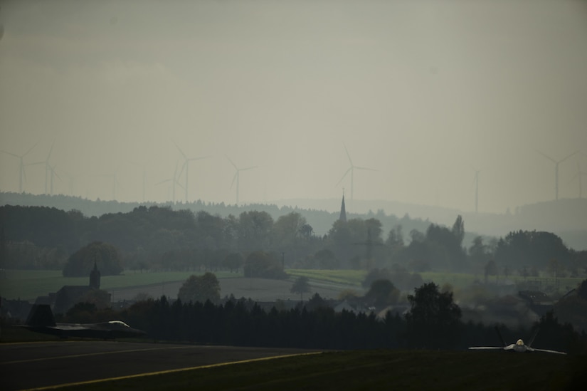 Two F-22 Raptors assigned to the 1st Fighter Wing, Joint Base Langley-Eustis, Va., taxi at Spangdahlem Air Base, Germany, Oct. 13, 2017.