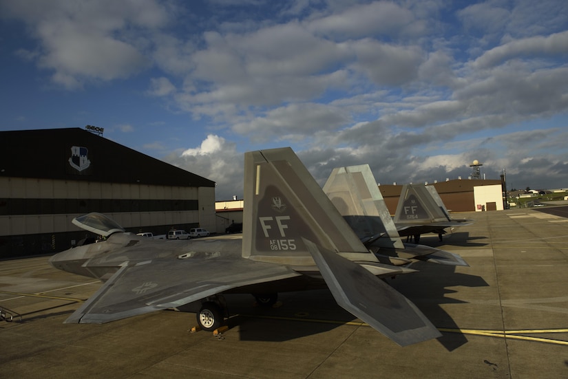 Two F-22 Raptors assigned to the 1st Fighter Wing, Joint Base Langley-Eustis, Va., sit on the flightline at Spangdahlem Air Base, Germany, Oct. 13, 2017.