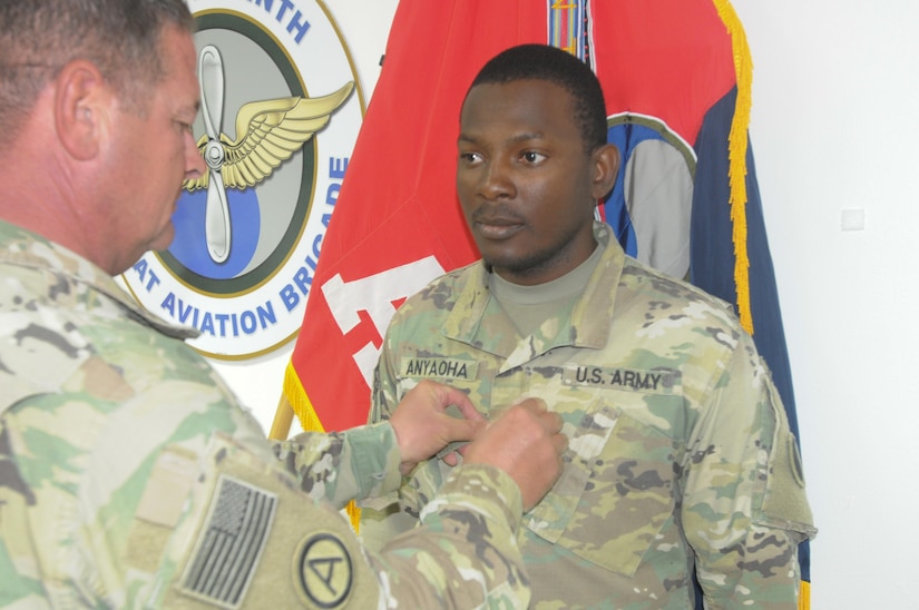 Solider receiving a patch during promotion.