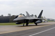 An F-22 Raptor taxis to the flightline on Royal Air Force Lakenheath, England, Oct. 19. Six F-22 Raptors transited through RAF Lakenheath. (U.S. Air Force photo/Airman 1st Class John Crawford)