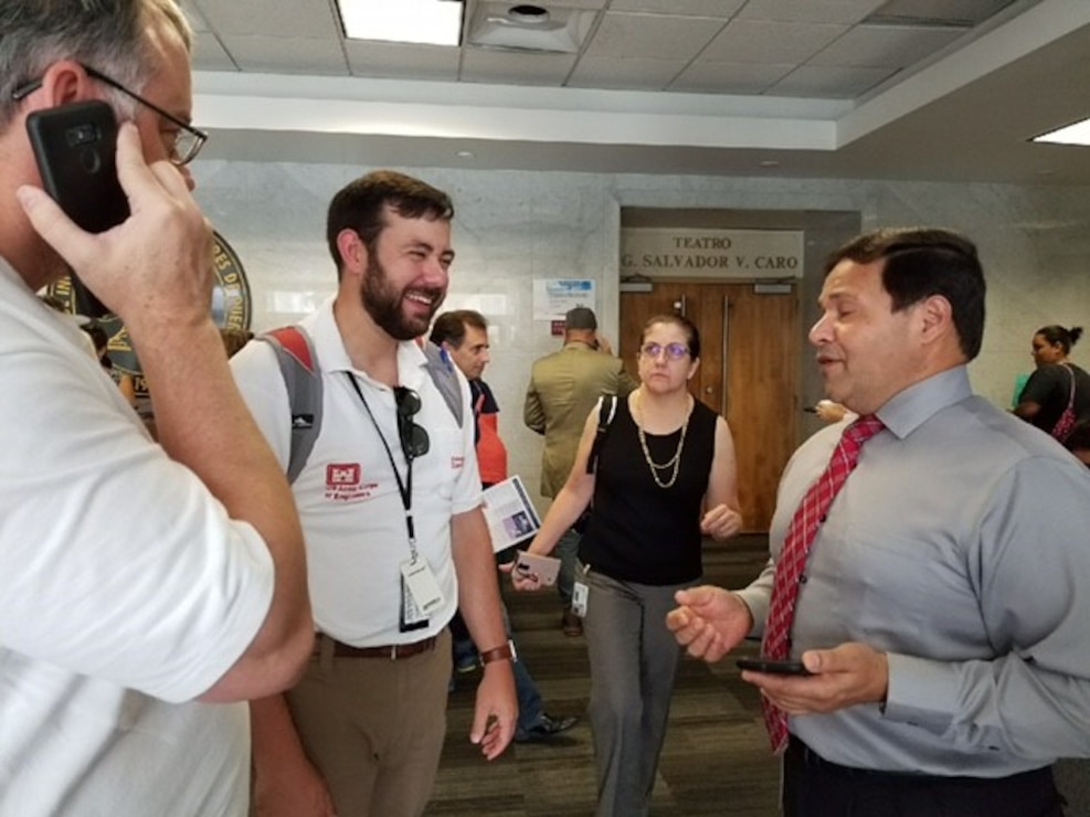 Robert McAllister, contracting officer from Mobile District, speaks with Pedro Acevedo of the Puerto Rico Industrial Development Company during the engagement.