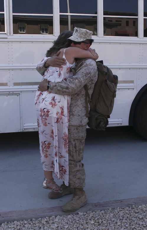 Cpl. Deric Kama, small arms technician, 1st Battalion, 7th Marine Regiment, embraces his wife, Mackenzie Kama, during 1/7’s homecoming at barracks 1403 and 1404 aboard the Marine Corps Air Ground Combat Center, Twentynine Palms, Calif., Oct. 13, 2017. The Marines had not seen their families for more than six months since being deployed, and for some Marines this was the first time they held their children.