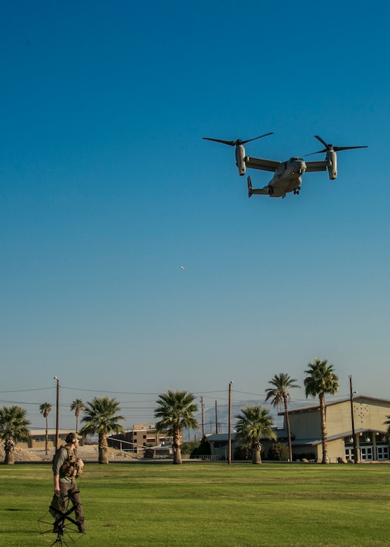 Master Sgt. Matthew Dank, air traffic controller, Marine Aviation Weapons and Tactics Squadron One, watches as a MV-22 Osprey comes in to land on Lance Cpl. Torrey L. Gray Field aboard the Marine Corps Air Ground Combat Center, Twentynine Palms, Calif., Oct. 13, 2017. The landing was conducted as part of a non-combatant evacuation operation exercise in order to prepare Marines for the evacuation of non-essential U.S. citizens and Department of Defense personnel from dangerous situations overseas. (U.S. Marine Corps photo by Lance Cpl. Isaac Cantrell)