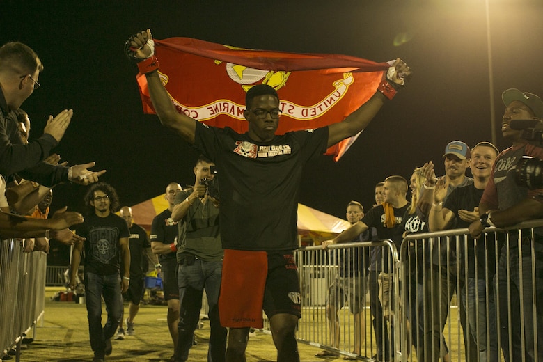 Cpl. Xavier Vines, a fighter with Fight Club 29, gets ready to enter the octagon during Fight Night at Victory Field, aboard the Marine Corps Air Ground Combat Center, Twentynine Palms, Calif., Oct. 13, 2017. Fight Night is an annual event hosted by Marine Corps Community Services to boost the morale of service members aboard the Combat Center. (U.S. Marine Corps photo by Lance Cpl. Isaac Cantrell)