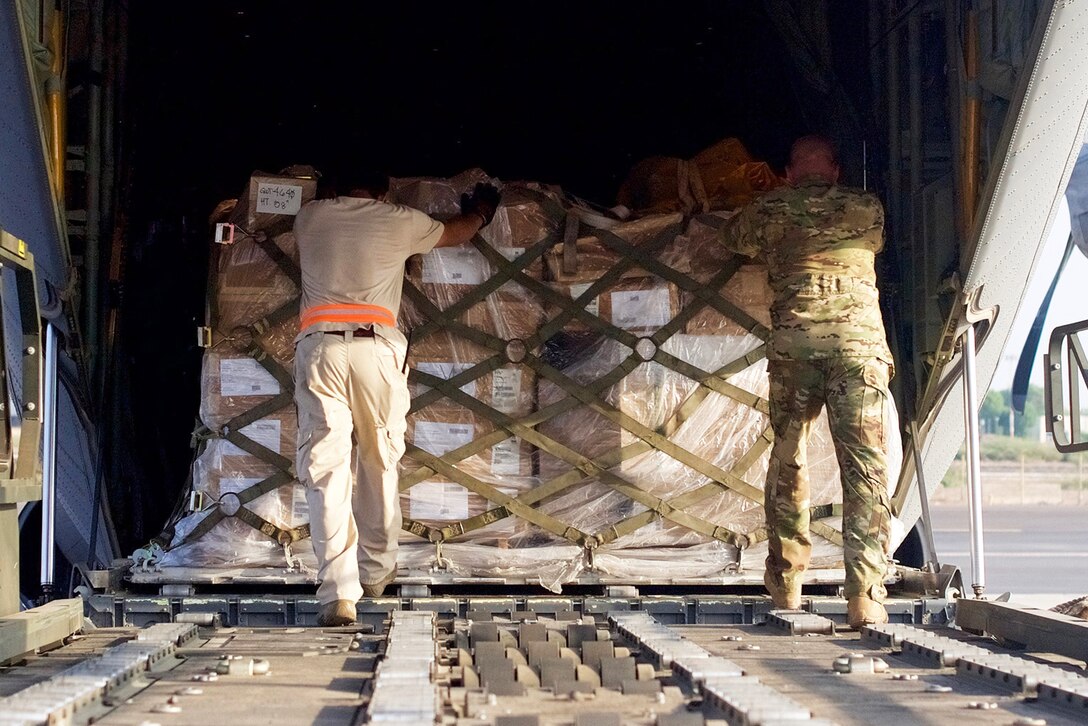 Airmen load humanitarian supplies for Somalia.